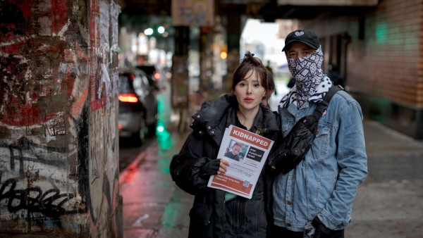 The Israeli street artist Nitzan Mintz and her partner, who goes by the name Dede Bandaid, put up posters in the Bushwick neighborhood of Brooklyn on Saturday, Oct. 14, 2023. Their campaign has taken off in cities across the world. (Anna Watts/The New Yor