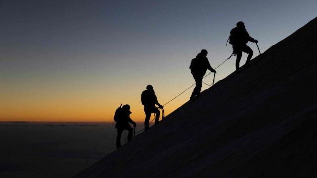 xxx: TOPSHOT - A group of mountaineers participate in an expedition to climb the 'Citlaltépetl' or 'Pico de Orizaba' volcano, the highest mountain in Mexico (5,636 m), in Puebla, Mexico, on November 25, 2023. Ximena, 22, is preparing to climb the top of the Pico de Orizaba volcano on crutches along with other Mexican and French cancer survivors. 'The mountain, more than a sport, is a therapy', she says. This young Mexican woman suffered amputations due to the disease, as did Erika, Fernando and David, who at her side set out to conquer the also called Citlaltepetl, which means Mount of the Star, the highest peak in Mexico at 5,610 meters. (Photo by Rodrigo Oropeza / AFP)