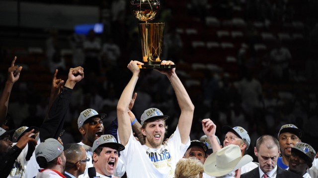 Dallas Mavericks in the NBA: The Mavs' greatest sporting moment: Dirk Nowitzki lifts the NBA trophy into the air in 2011 - his friend Mark Cuban cheers next to him.