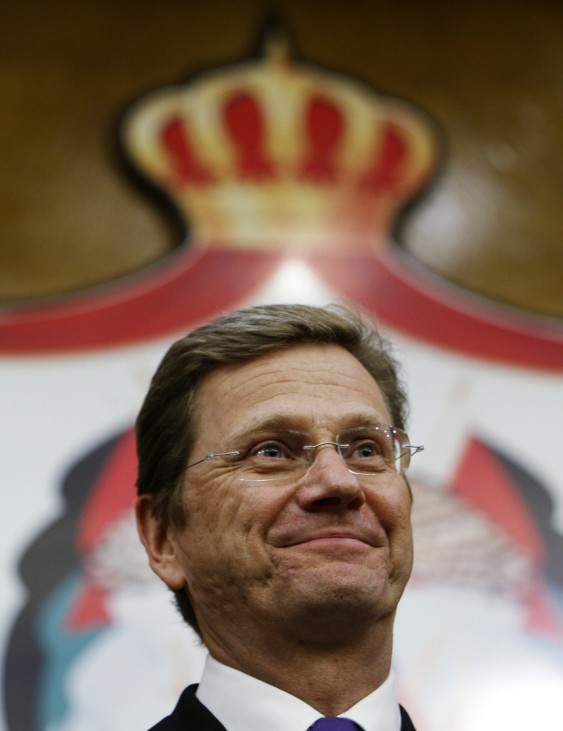 German's Foreign Minister Guido Westerwelle smiles during a news conference in Amman