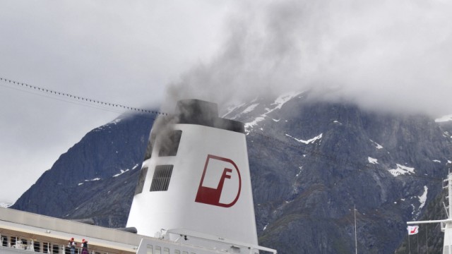 Smoke billows from the cruise ship MS Deutschland at a port in Eidfjord