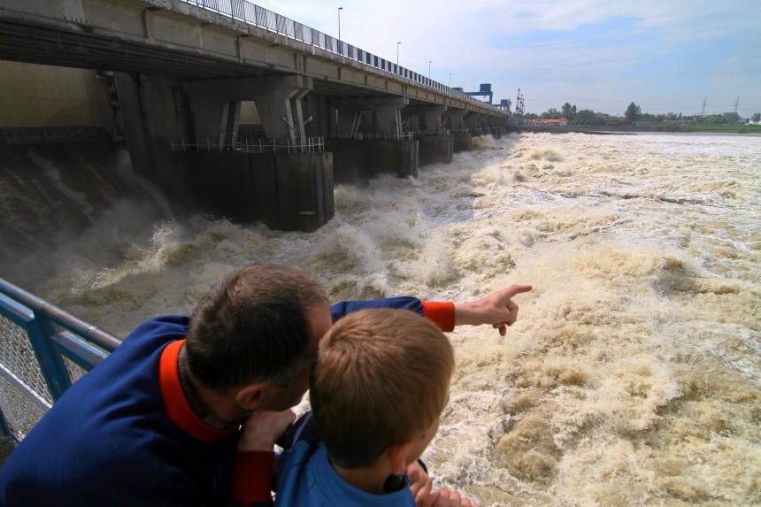 People look at the high waters of the Wisla river from the water dam, after flash floods in Wloclawek
