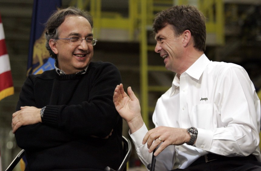 Chrysler Group LLC CEO Sergio Marchionne and Jeep Brand President and CEO Michael Manley laugh during a celebration to launch the all-new 2011 Jeep Grand Cherokee in Detroit