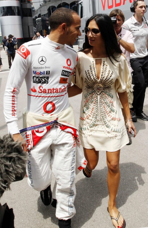 McLaren Formula One driver Hamilton of Britain walks at the paddock with Scherzinger before the qualifying session for the Turkish F1 Grand Prix at the Istanbul Park circuit in Istanbul
