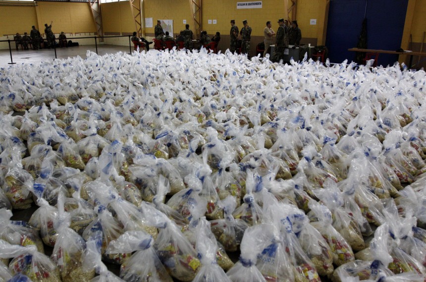 Food parcels which are ready to be delivered to areas affected by the heavy rain, are seen in San Salvador