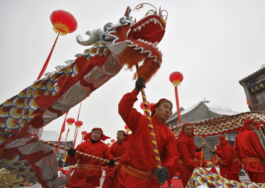 Participants perform a dragon dance during a temple fair to celebrate the upcoming Lunar New Year in Beijing