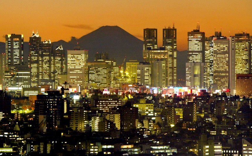 TOKYO'S SHINJUKU SKYSCRAPERS FRAME MOUNT FUJI AT DUSK