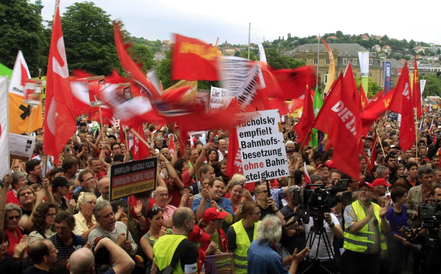People attend a demonstration against German government plans on budget cuts and taxes in Stuttgart