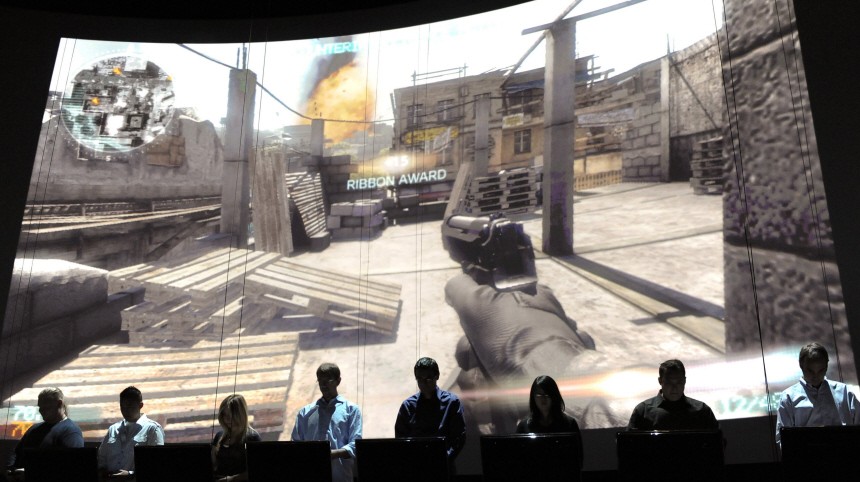 Gamers demonstrate Electronic Arts' soon to be released Medal of Honor's online multiplayer feature during their press briefing ahead of the Electronic Entertainment Expo in Los Angeles