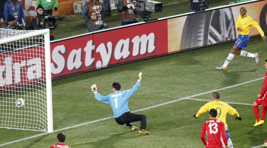 Brazil's Maicon scores past North Korea's goalkeeper Ri Myong-guk during a 2010 World Cup Group G soccer match in Johannesburg