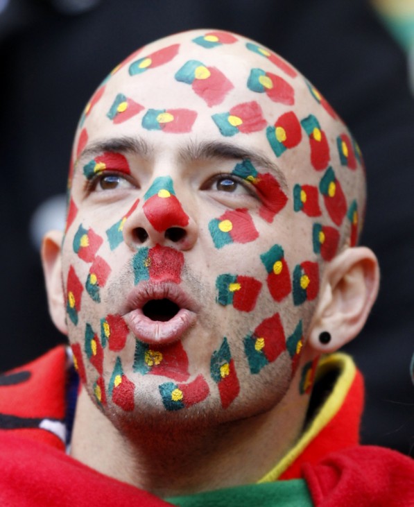 A fan with the colours of Portugal's national flag painted on his face is seen at a 2010 World Cup Group G soccer match in Port Elizabeth