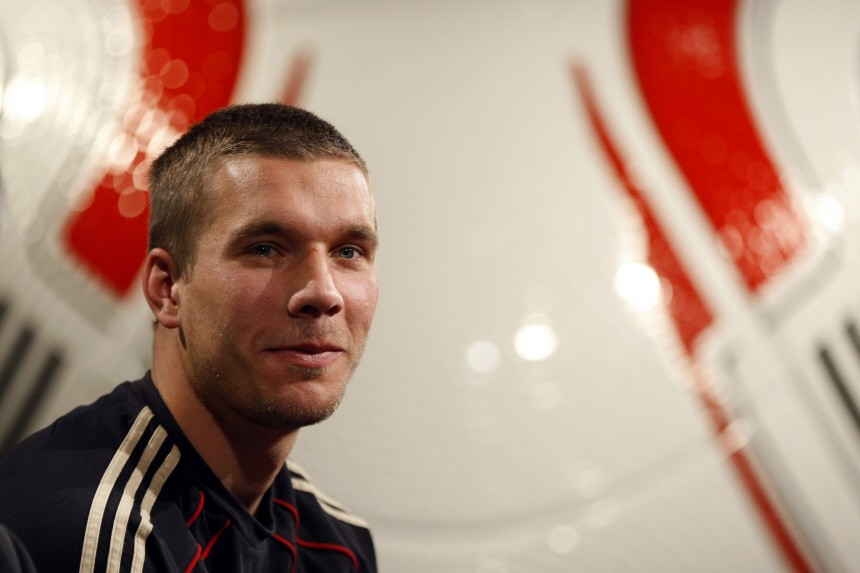 Germany's Podolski addresses a news conference at the Velmore hotel in Pretoria