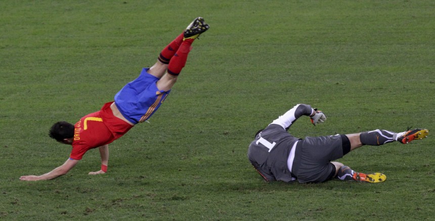 Spain's Villa goes over Switzerland's goalkeeper Benaglio during a 2010 World Cup Group H match at Moses Mabhida stadium in Durban