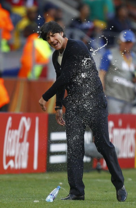 Germany's coach Joachim Loew reacts with frustration as he throws a water bottle during the 2010 World Cup Group D soccer match against Serbia at Nelson Mandela Bay stadium in Port Elizabeth