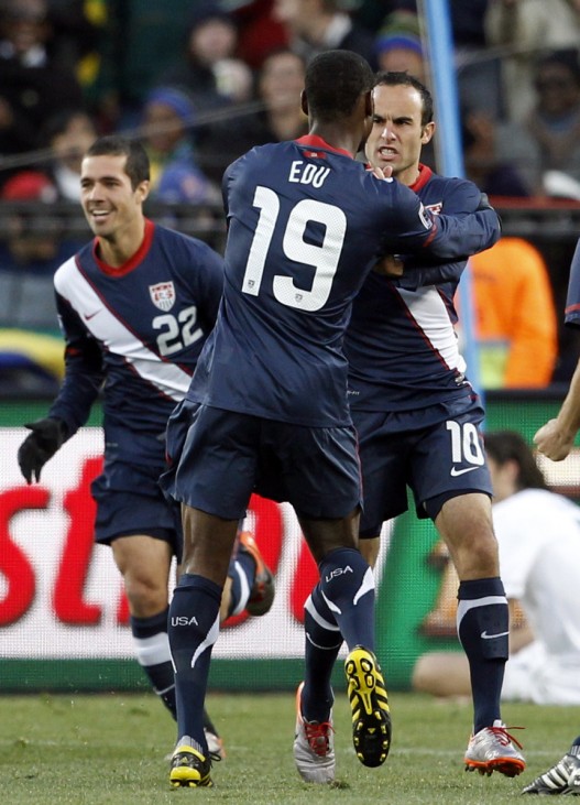 Donovan of the US celebrates with team mate Edu after scoring against Slovenia during a 2010 World Cup soccer match at Ellis Park stadium in Johannesburg