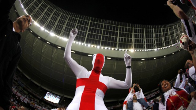 England fan wears an outfit featuring the cross of St George before the 2010 World Cup Group C soccer match against Algeria at Green Point stadium in Cape Town