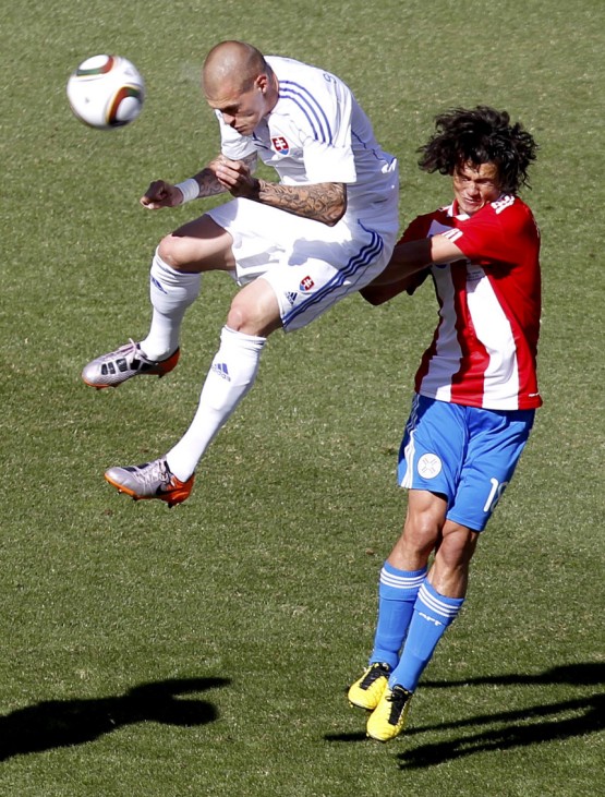 Slovakia's Martin Skrtel fights for the ball with Paraguay's Nelson Haedo Valdez during their 2010 World Cup Group F soccer match at Free State stadium