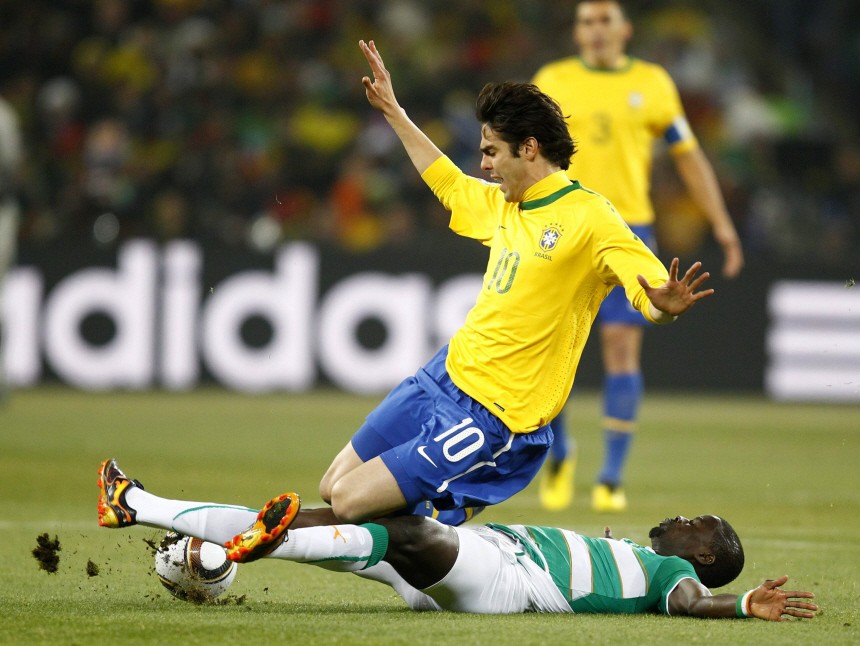 Ivory Coast's Eboue fights for the ball with Brazil's Kaka during a 2010 World Cup Group G soccer match at Soccer City stadium in Johannesburg