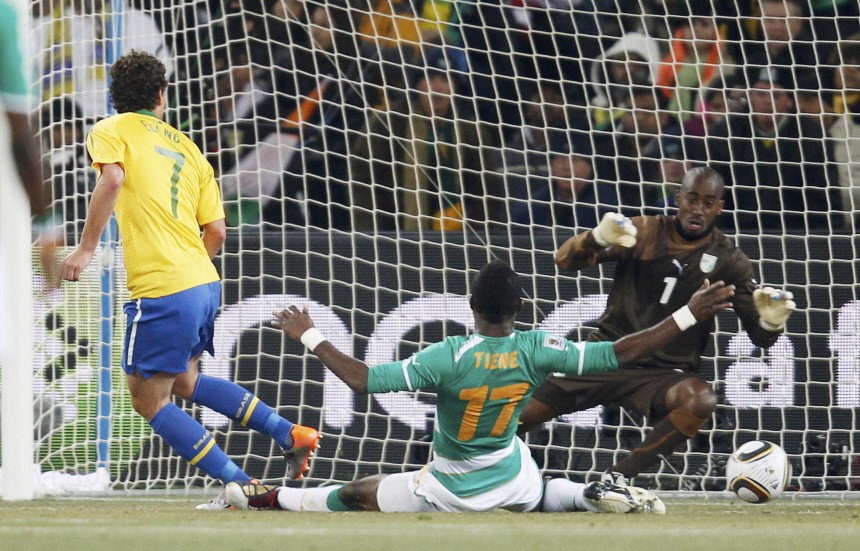 Brazil's Elano shoots to score his goal past Ivory Coast's goalkeeper Boubacar Barry during the 2010 World Cup Group G soccer match at Soccer City stadium in Johannesburg