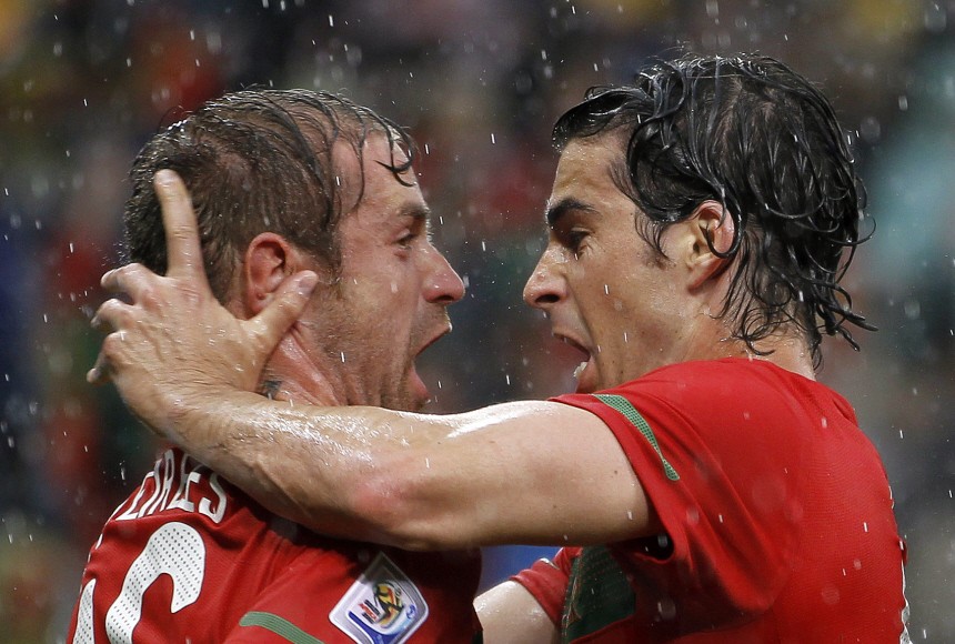Portugal's Meireles celebrates with team mate Tiago after scoring during a 2010 World Cup Group G soccer match at Green Point stadium in Cape Town