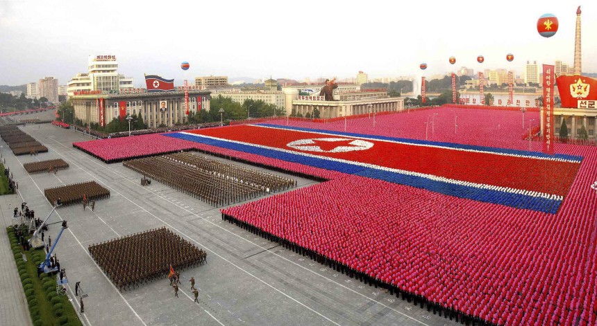 North Koreans participate in celebrations for the 60th anniversary of the founding of North Korea in Pyongyang