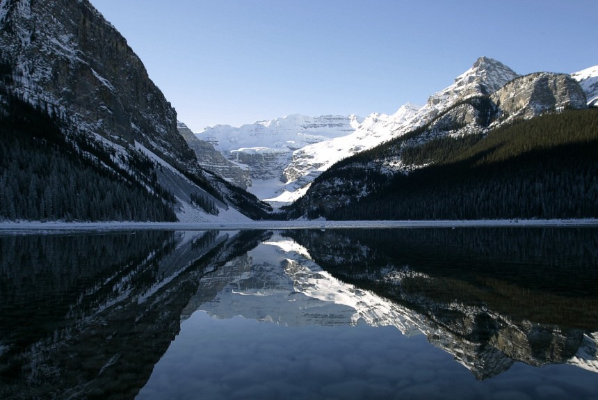 Mountains in Canada's Banff National Park are reflected in Lake Louise
