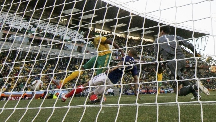 South Africa's Katlego Mphela (9) shoots to score their second goal past France's goalkeeper Hugo Lloris (R) during their 2010 World Cup Group A soccer match at Free State stadium in Bloemfontein