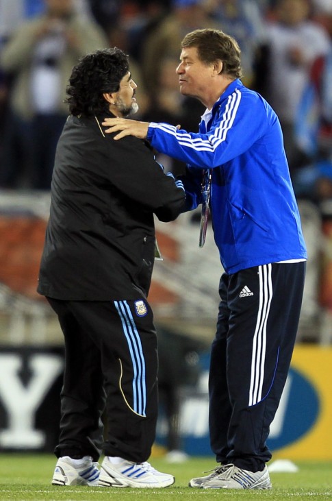 Argentina's coach Maradona and Greece's coach Rehhagel talk on the field before a 2010 World Cup Group B soccer match between their teams in Polokwane