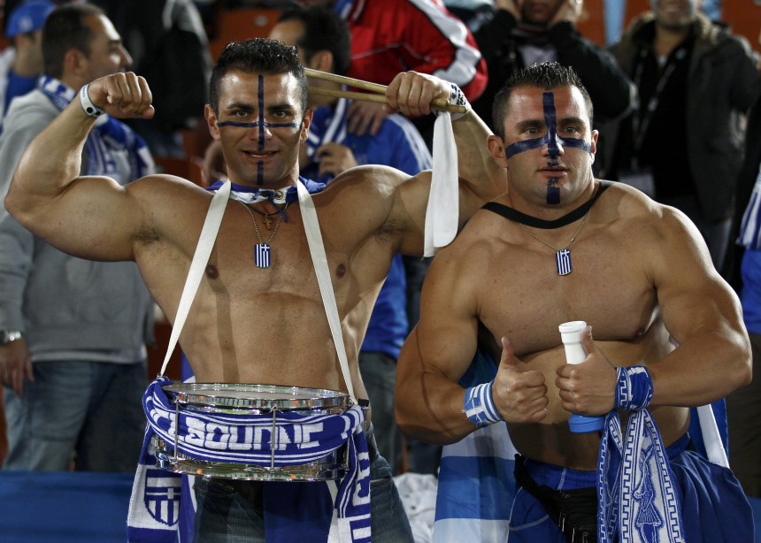 Greece fans pose ahead of a 2010 World Cup Group B soccer match against Argentina in Polokwane