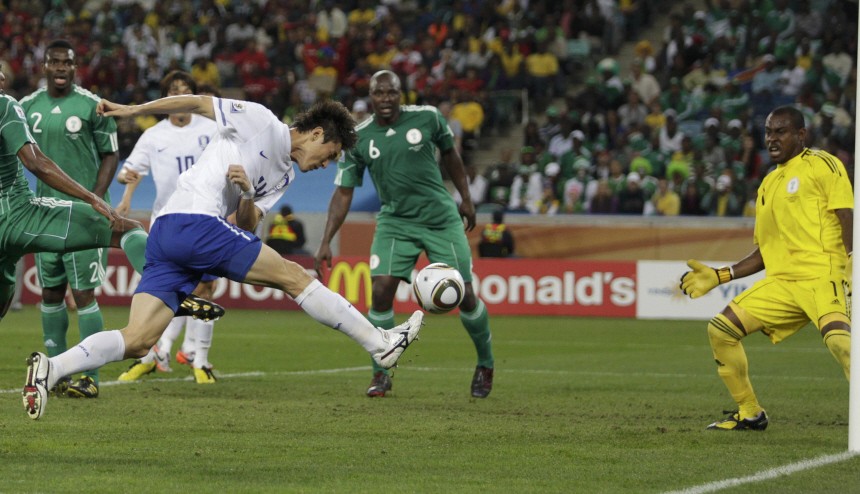 South Korea Lee Jung-soo shoots to score past Nigeria goalkeeper Vincent Enyeama during a 2010 World Cup Group B soccer match at Moses Mabhida stadium in Durban
