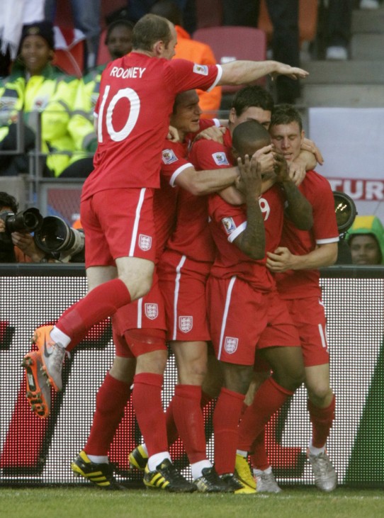 England's Defoe is congratulated after scoring his team's opening goal against Slovenia during their 2010 World Cup Group C soccer match in Port Elizabeth