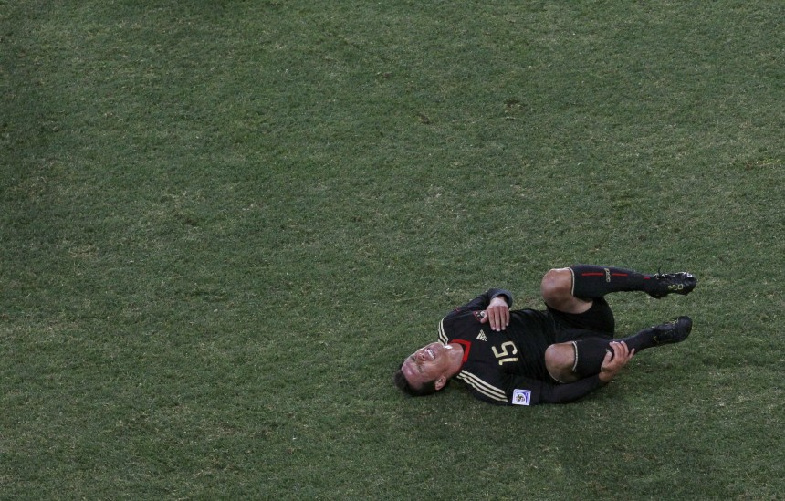 Germany's Trochowski reacts after getting hit on the leg during the 2010 World Cup Group D soccer match against Ghana in Johannesburg
