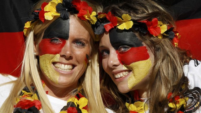 German football fans pose before a 2010 World Cup second round soccer match between England and Germany at Free State stadium in Bloemfontein
