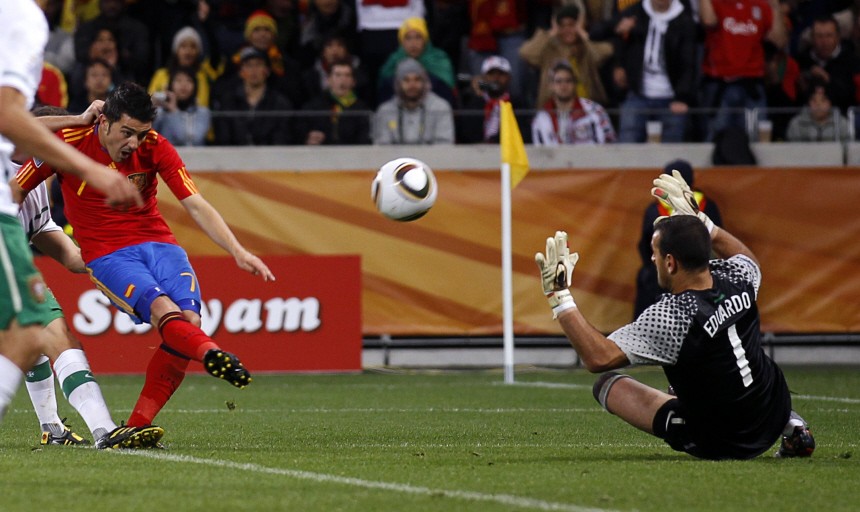 Spain's Villa shoots to score against Portugal during the 2010 World Cup second round soccer match at Green Point stadium in Cape Town