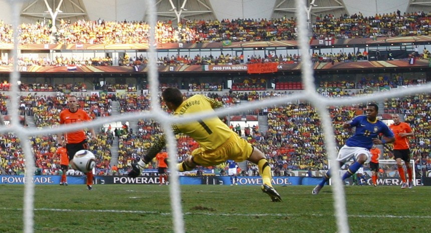 Brazil's Robinho shoots to score a goal past goalkeeper Maarten Stekelenburg during their 2010 World Cup quarter-final soccer match in Port Elizabeth