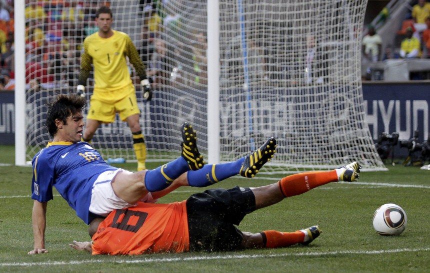 Netherlands' de Jong tackles Brazil's Kaka during their 2010 World Cup quarter-final soccer match in Port Elizabeth