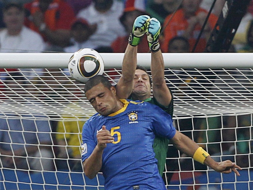 Brazil's Felipe Melo scores an own goal past his goalkeeper Julio Cesar during the 2010 World Cup quarter-final soccer match against Netherlands in Port Elizabeth