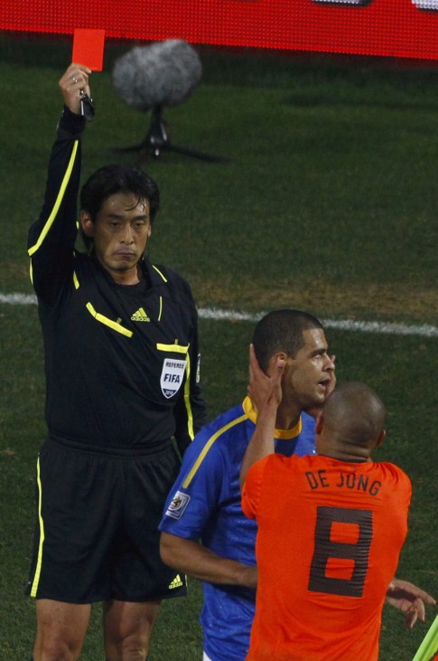 Referee Nishimura shows the red card to Brazil's Melo during their 2010 World Cup quarter-final soccer match in Port Elizabeth