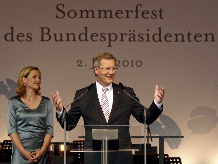 Newly sworn-in German President Christian Wulff speaks as his wife Bettina looks on during the summer reception at the presidential residence Bellevue palac in Berlin