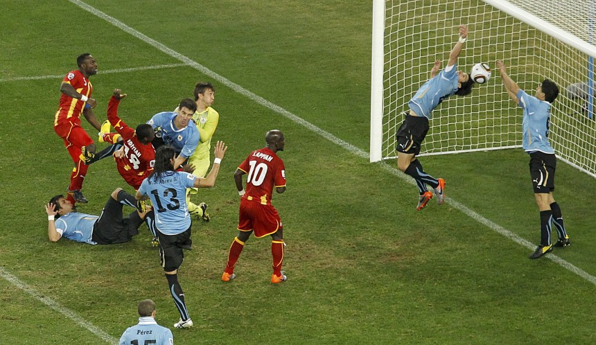 Uruguay's Luis Suarez saves the ball with his hands during a 2010 World Cup quarter-final soccer match at Soccer City stadium