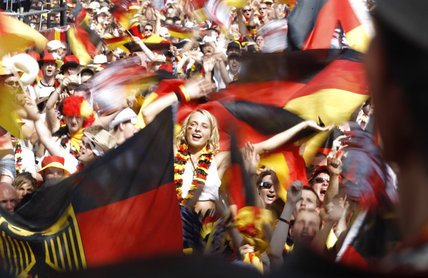 Soccer fans react during screening of 2010 World Cup quarter-final match in Berlin