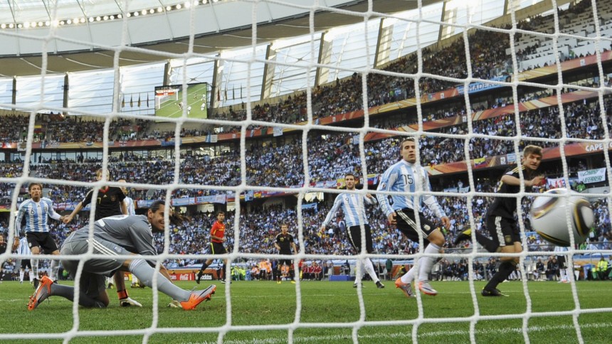 Germany's Thomas Mueller heads in the first goal past Argentina's goalkeeper Sergio Romero during their 2010 World Cup quarter-final soccer match at Green Point stadium in Cape Town