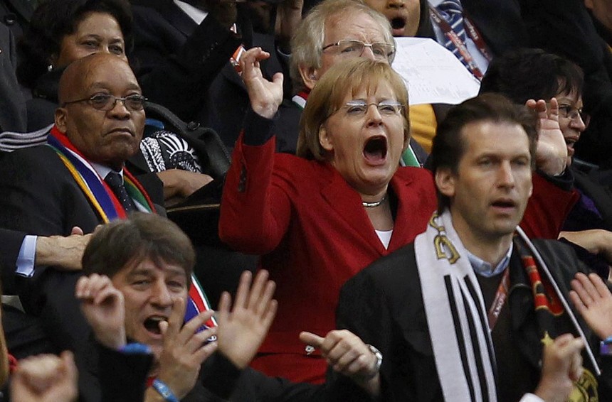 German Chancellor Angela Merkel celebrates Germany's fourth goal during the 2010 World Cup quarter-final soccer match against Argentina at Green Point stadium in Cape Town