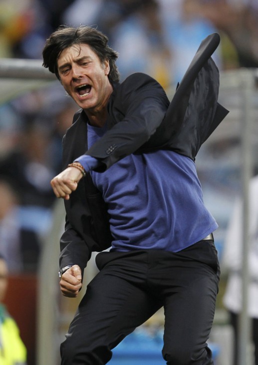 Germany's coach Loew celebrates the team's third goal during the 2010 World Cup quarter-final soccer match against Argentina at Green Point stadium in Cape Town