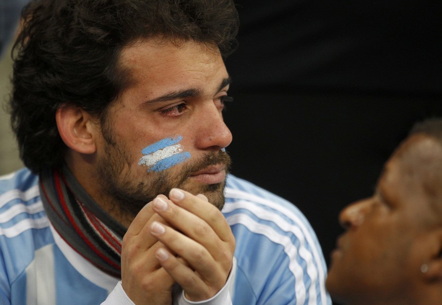 An Argentina fan reacts after the 2010 World Cup quarter-final soccer match between Argentina and Germany at Green Point stadium in Cape Town