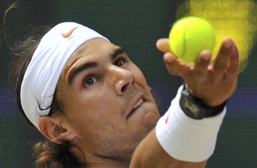 Spain's Rafael Nadal serves to Tomas Berdych of the Czech Republic during the men's singles final at the 2010 Wimbledon tennis championships in London