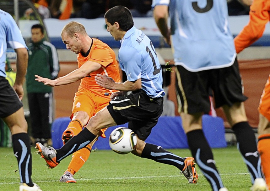Netherlands' Sneijder scores a goal during the 2010 World Cup semi-final soccer match against Uruguay at Green Point stadium in Cape Town