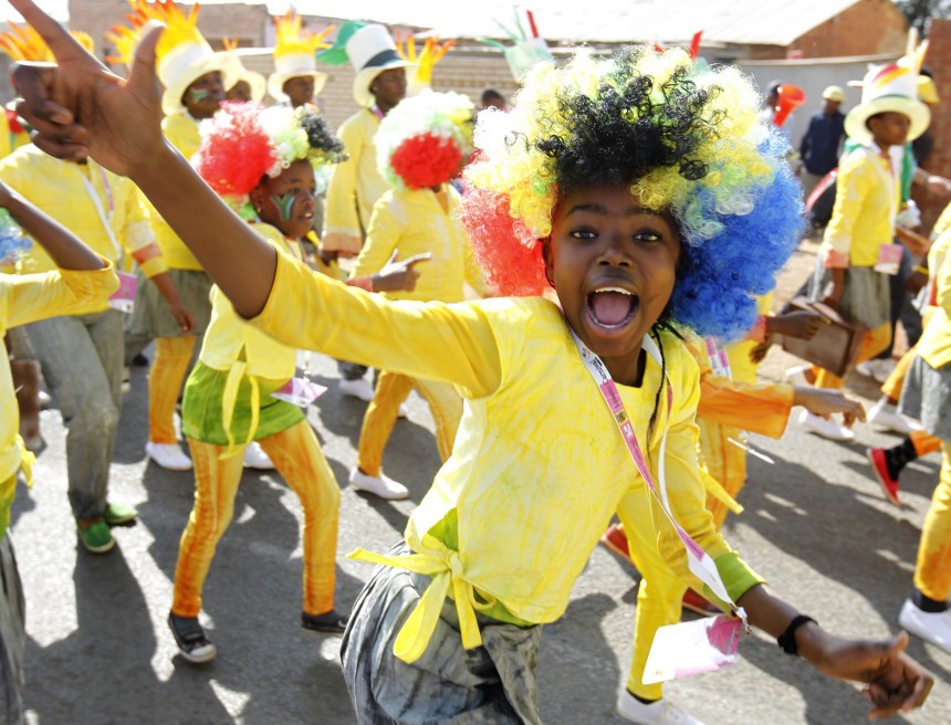 Performers dance during a carnival parade themed 'Mzansi's legacy' in Soweto