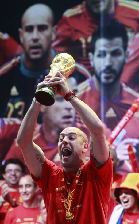 Spain's Pepe Reina lifts the World Cup trophy as he celebrates with team mates their victory in Madrid