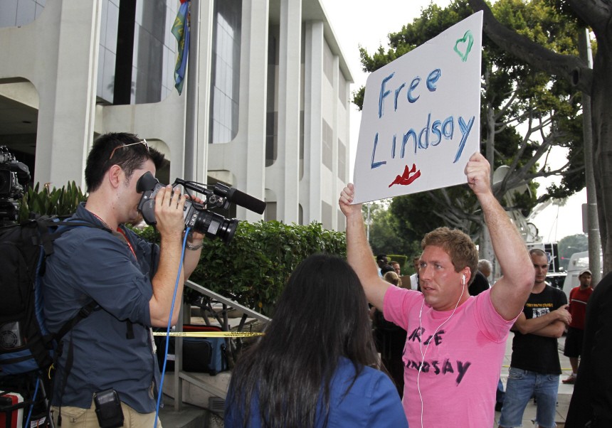 A fan holds a sign asking for freedom for actress Lindsay Lohan outside at the Beverly Hills Municipal Courthouse
